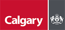 The City of Calgary’s official crest: The upper third of the crest displays a setting sun above a mural crown (a symbol of loyalty).  The top of the shield is another sun, this one setting behind the majestic Rocky Mountains.  The lower two-thirds of the shield ;bears the cross of St. George (the patron saint of England) and the Canadian maple leaf, which is inset by a bull buffalo (the former master of our region).  The shield is supported on either side by a horse and a steer, representing the city’s roots in agriculture.  Below the shield are the leek of Wales, the shamrock of Ireland, the rose of England and the thistle of Scotland. All reference the ancestry of the majority of early settlers to the region.  The crest includes our motto, Onward, and the dates of Calgary’s incorporation as a town (1884) and as a city (1894).  Under the scroll the Union Jack, signifying our relationship with the British Commonwealth, and the Red Ensign, Canada’s flag until 1965.
